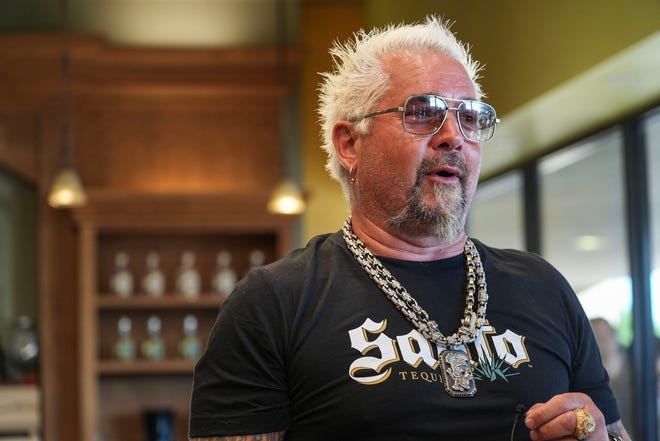 Guy Fieri arrives for a meet-and-greet at Twins Liquor at the Hancock Center on Thursday, March 28, 2024. Fieri came to Texas in support of his and Sammy Hagar’s Santo Spirits brand.